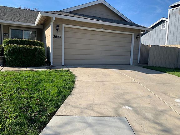 Garage to hold 2x cars and it's ramp; To the right of garage there is a walk way to hide garbage bins