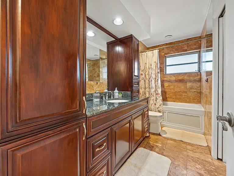 Primary Bathroom, marble with plenty of cabinets for storage