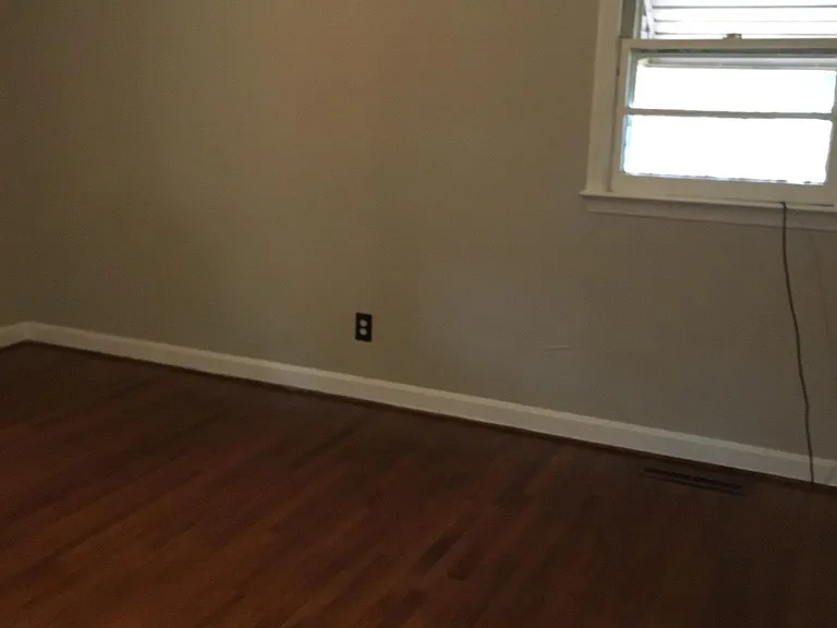 bedroom with hardwood floors.