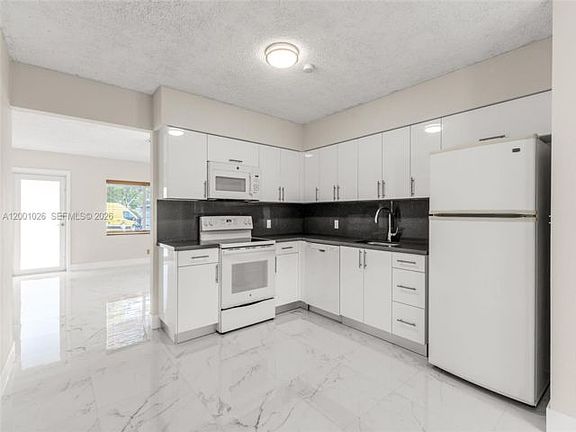 3rd image of 310 SW 76th Ct