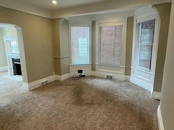 Dining Room with bay windows looking back towards living room from back hallway