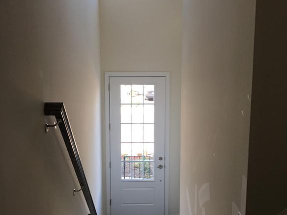 Entrance with Hardwood Foyer and Stairs