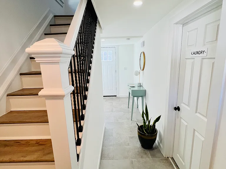 Dual entry on the first floor with hallway closet. Living space on the second floor.