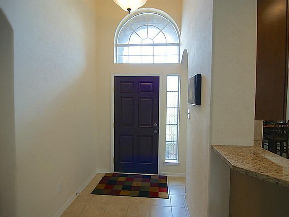 Inviting entry with attractive tile floors.