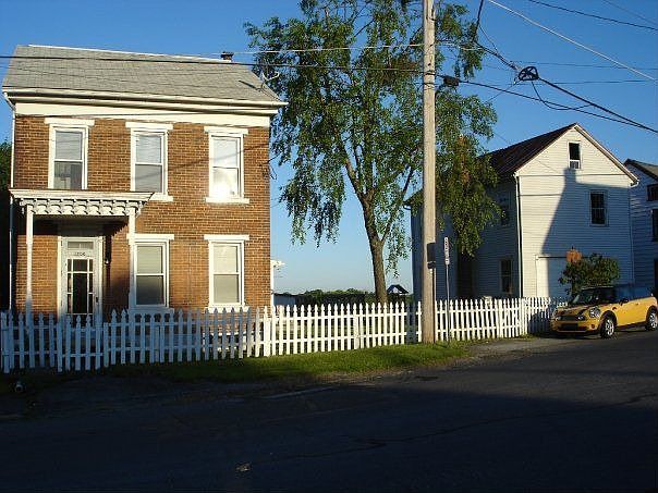 House from the street, front of barn to the right.