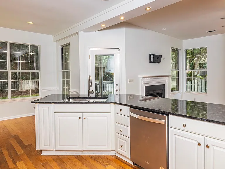 Kitchen looking into family room and breakfast nook