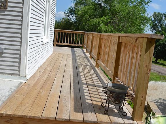 The deck wraps around to the front porch.