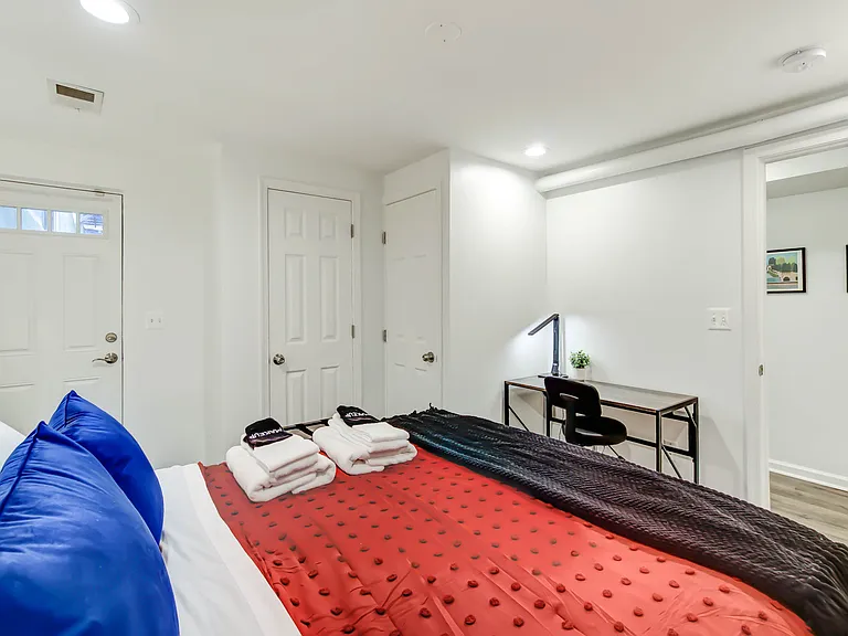 This room offers ample space to comfortably incorporate a desk or dedicated workspace, perfect for working or studying from home.