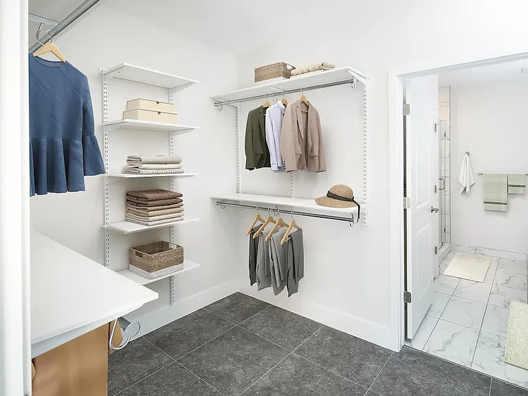 Signature Collection Townhome primary bedroom with spacious walk-in closet