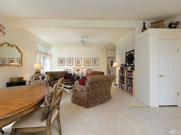 Vaulted ceilings add sense of space to the living room.