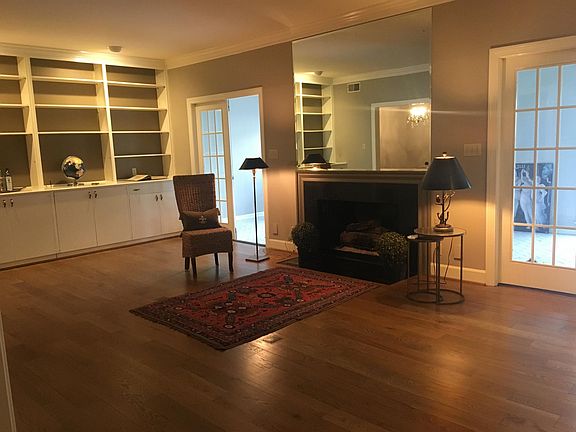 Living room with view into downstairs sunroom