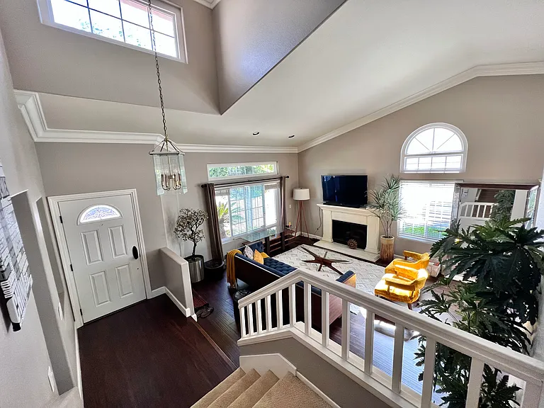 This is a staged picture of the front entrance and living room.