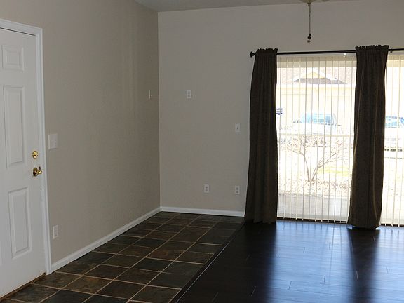 Living room with tile and wood floors