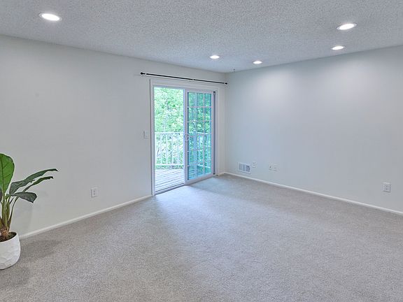 Spacious living room with recessed lighting, fresh paint, and an easy, open flow throughout.