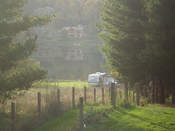 view from porch(more trees could be cleared for an expanded view of Long Lake)