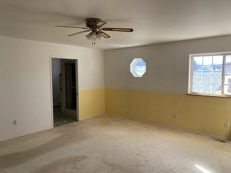 Generous master suite with 2 walk-in closets, ensuite bath and a ceiling fan.