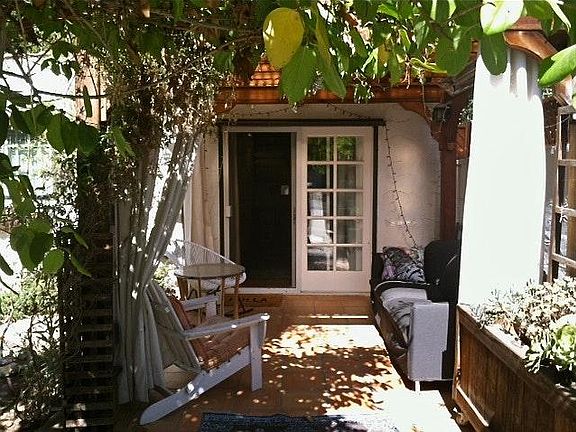 Serene and private pergola patio seating area.