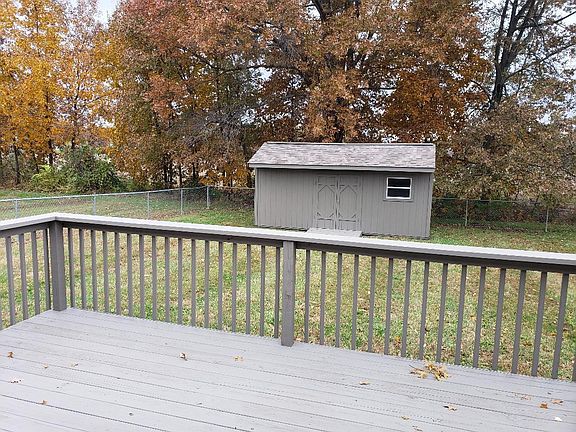 Amazing private fenced rear yard with large quality storage building