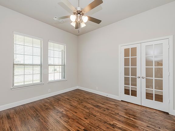 Office room to the right side of front door.