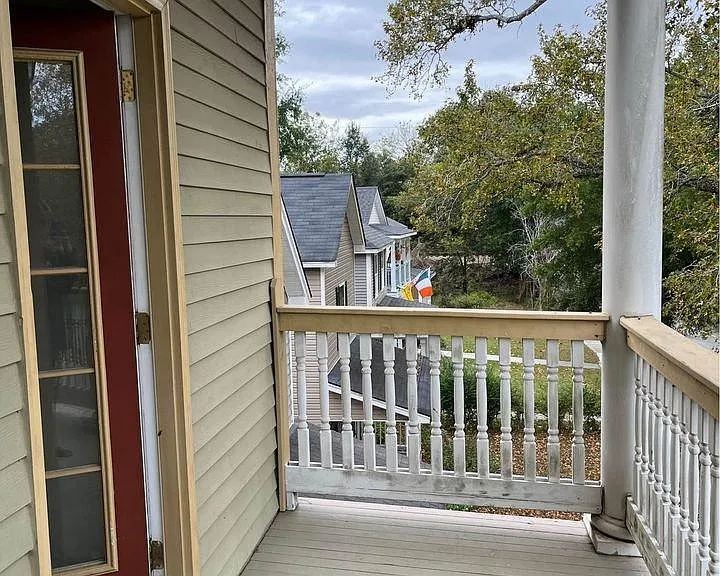 Private front porch entrance with the unit's own door.