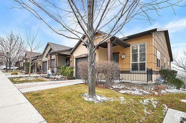 end unit townhome with pathway that leads to the clubhouse
