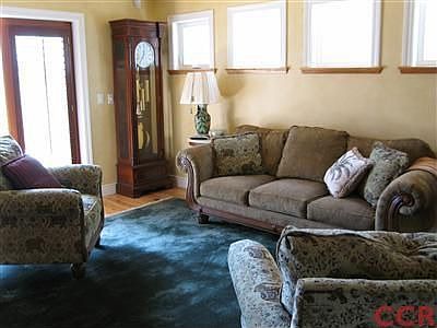 Family room with patio doors leading to the back patio and back yard