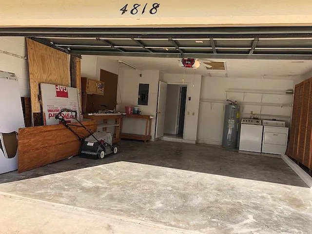 2-car garage with laundry appliances
