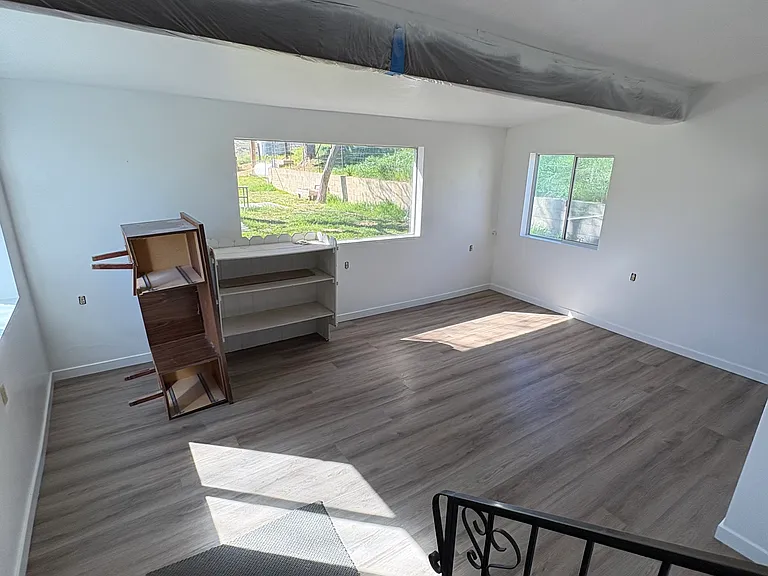 Downstairs Bedroom with new flooring and paint