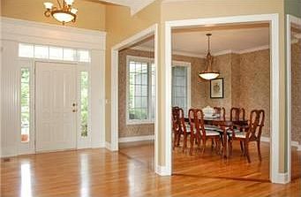 Inviting two-story foyer has hardwood floors that continue throughout the entire main level.