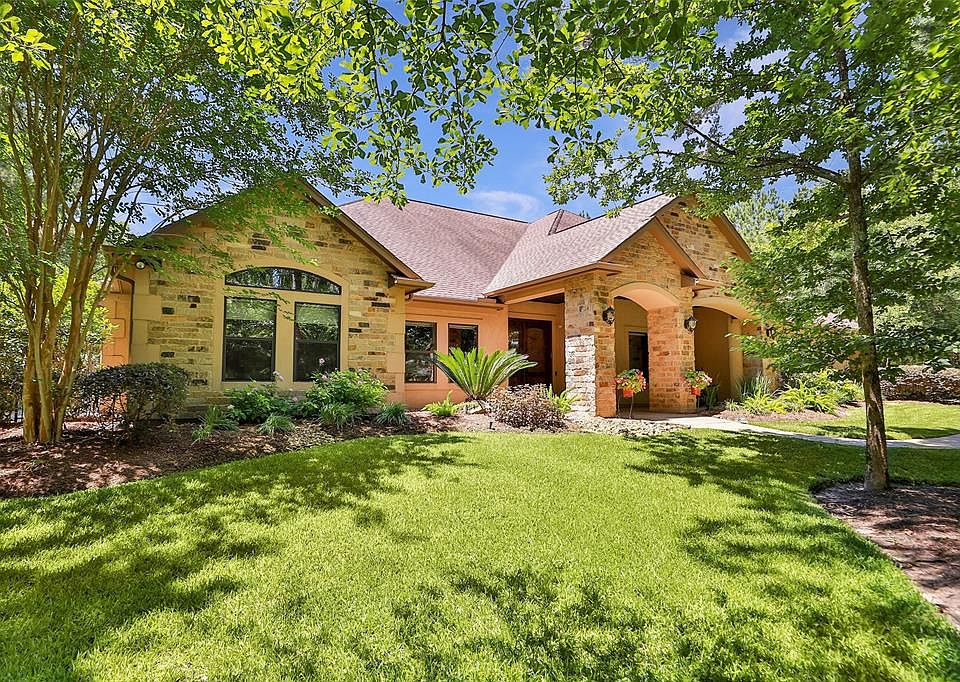 Welcome home! Nestled on 2.77 acres of a woodland paradise, this single level starts the tour strong with beautifully manicured curb appeal!
