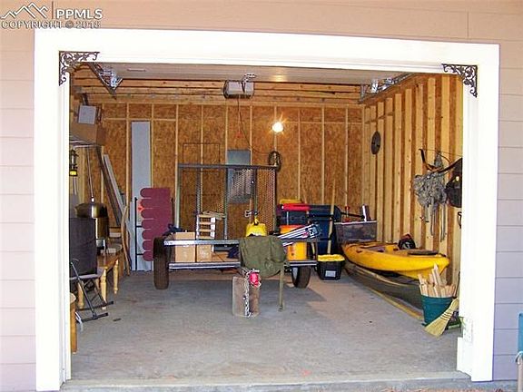 Nice Garage to store your toys or to store your building supplies while you Build!  Garage Door Opener included