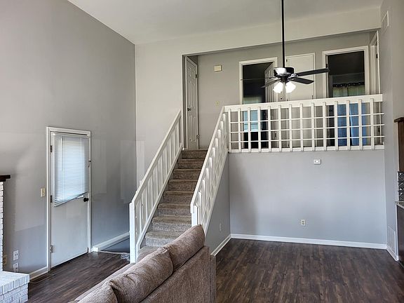 Door to the backyard, stairs to downstairs oversized room, stairs to upstairs bedrooms and bathroom.
