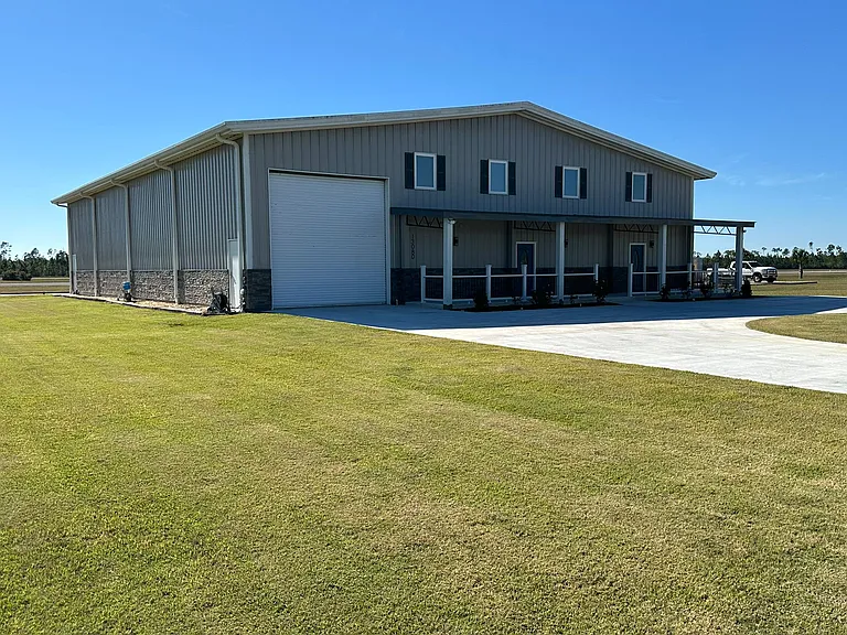 Front view. Large sodded grass area for play time