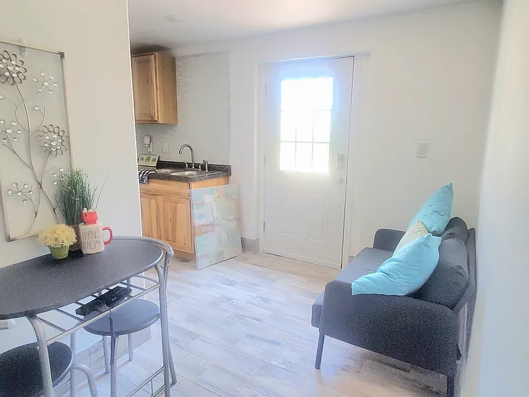 Bright and welcoming open-concept living area. A wonderfully designed space that seamlessly combines dining, relaxation, and kitchen functions for your comfortable daily life.