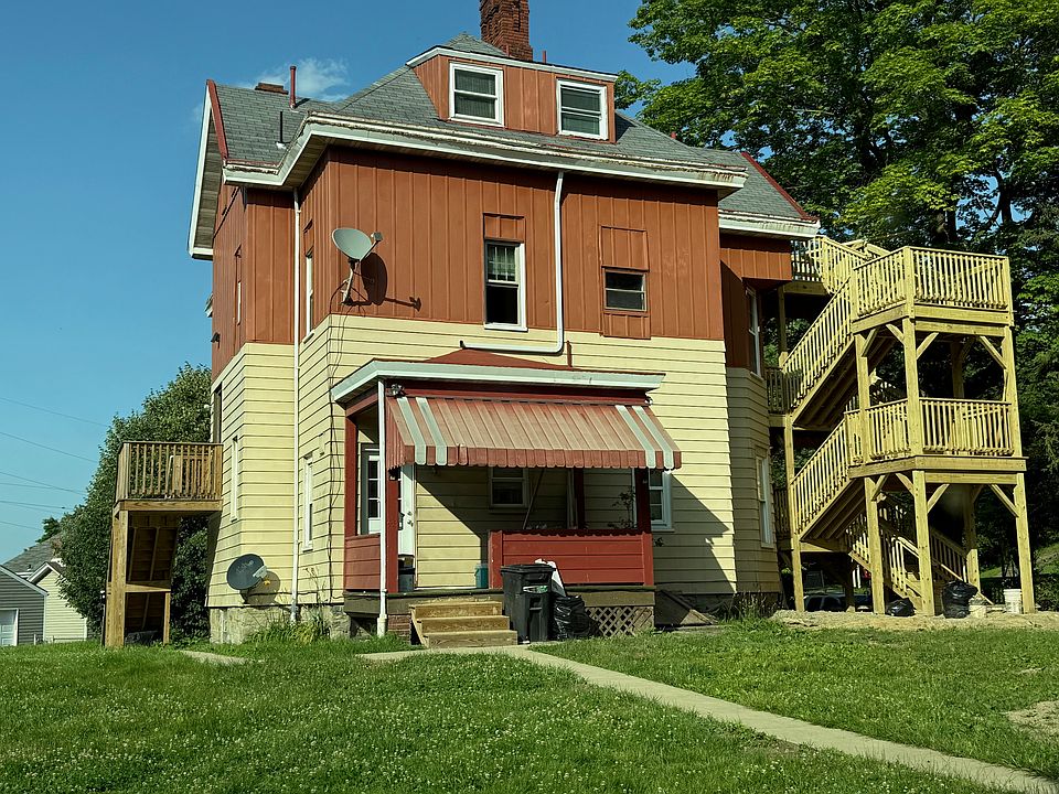Exterior rear -- back porch is exclusively for this unit's use.