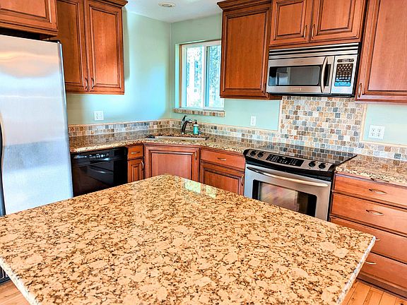 Kitchen with Granite counters, Island with space for bar stools.