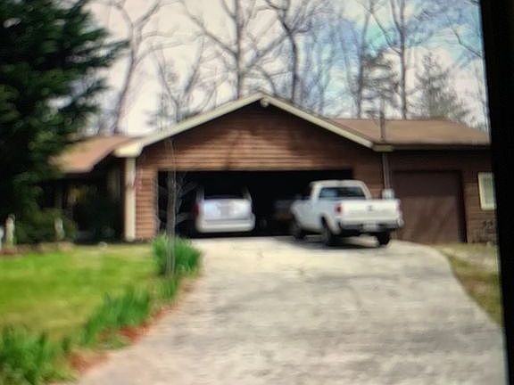 Home with spacious shop. 