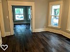 Main living room. View to bedroom #1 with French doors.