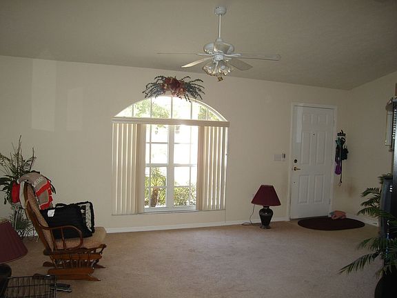 Front door entryway to living/TV area, also custom blinds.