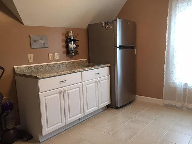 Kitchen with granite and stainless steel appliances