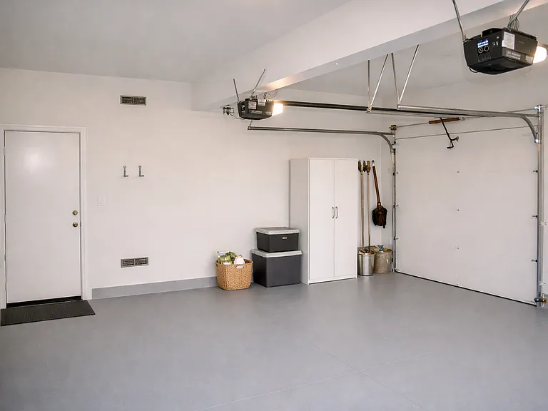 Two car garage with ample storage space and direct home access
