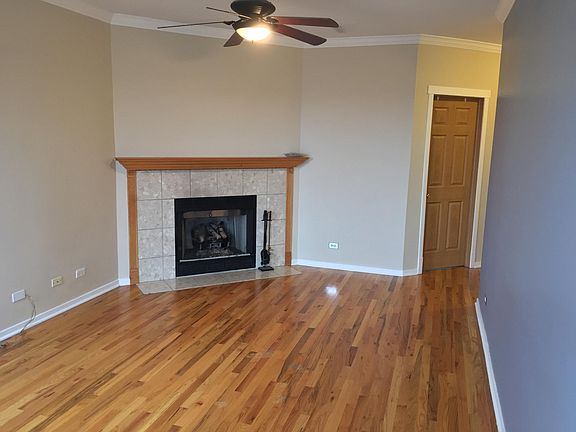 Living Room with Fireplace and Ceiling Fan