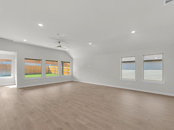 Living Room in the Pecos home plan by Trophy Signature Homes - REPRESENTATIVE PHOTO