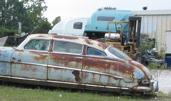 this is a car that is sitting in the backyard of this trailer. good car.