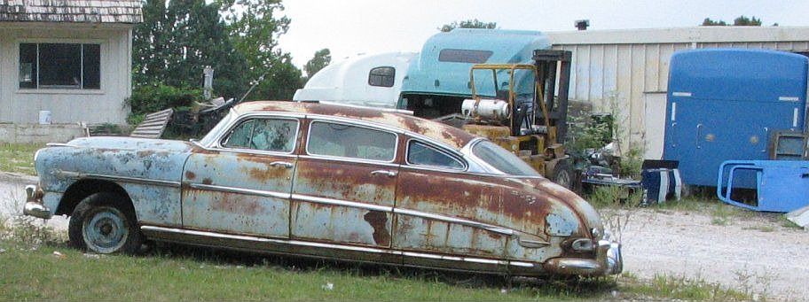 this is a car that is sitting in the backyard of this trailer. good car.