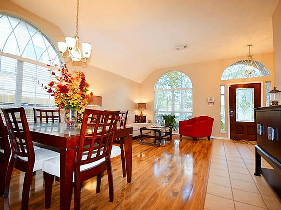 Entry to a beautiful home with high ceilings.