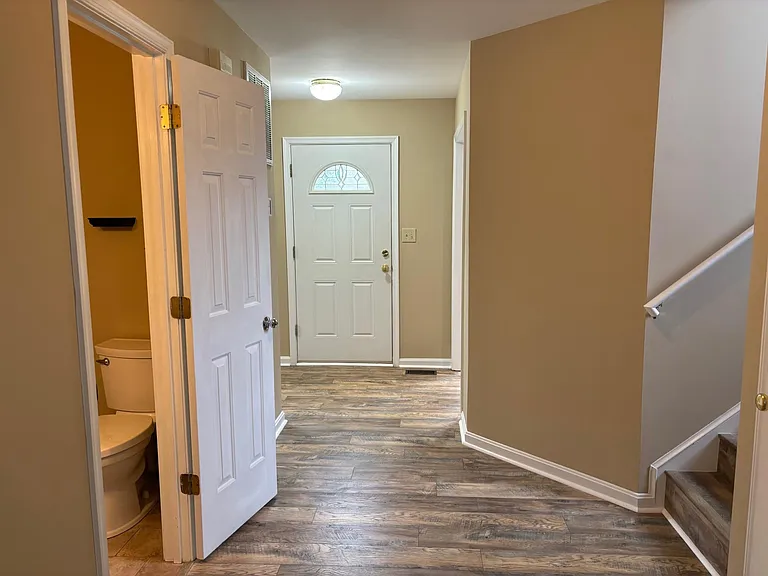 Front door entry space and downstairs half bath.