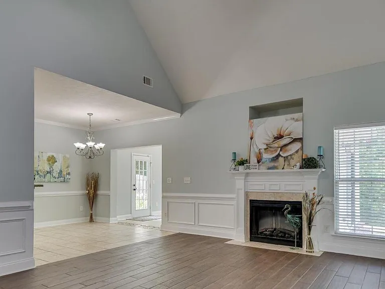 Living room, breakfast area with part of the sun room