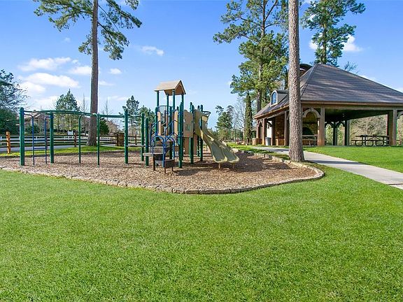 Playground and pavilion with a fireplace and seating. A wonderful location to host small gatherings.