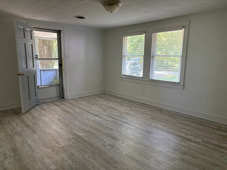 Living room opens to screened porch. Double pane energy efficient windows with 2"blinds. New LVP flooring.